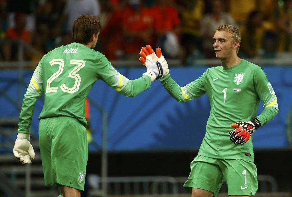 Goalkeeper Tim Krul of the Netherlands goes in for team mate Jasper Cillessen during extra time in their 2014 World Cup quarter-finals against Costa Rica at the Fonte Nova arena in Salvador